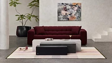 Blinde Design Bloc L1-L3 concrete coffee tables anchor the modern living room of a private residence with sculptural minimalist flair.